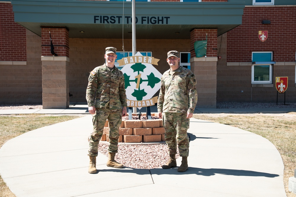 Two RAID-T leaders standing outside the Raider Brigade headquarters at Fort Carson.